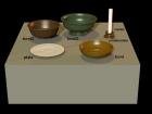 Bowls, plate and candle