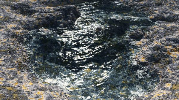 Small pond of water near the big ocean.